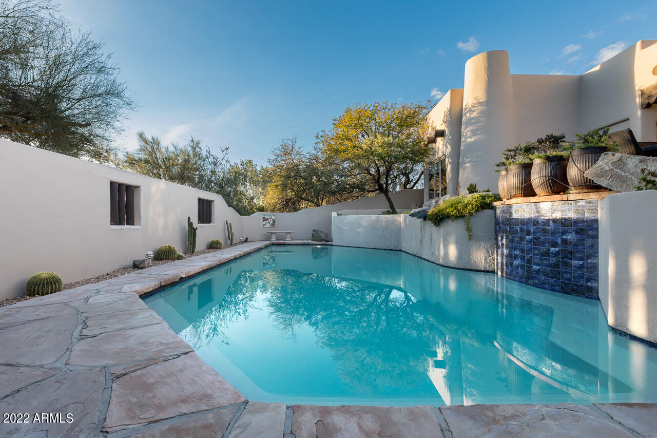 10801 East Happy Valley Road, Unit 74 Scottsdale, AZ 85255 - Photo 22 of 27 a view of a swimming pool with a patio