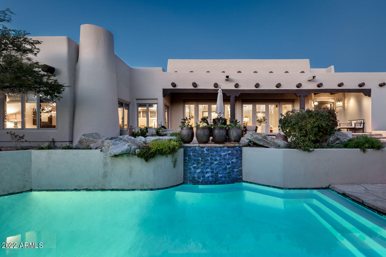 10801 East Happy Valley Road, Unit 74 Scottsdale, AZ 85255 - Photo 23 of 27 a view of a swimming pool with outdoor seating