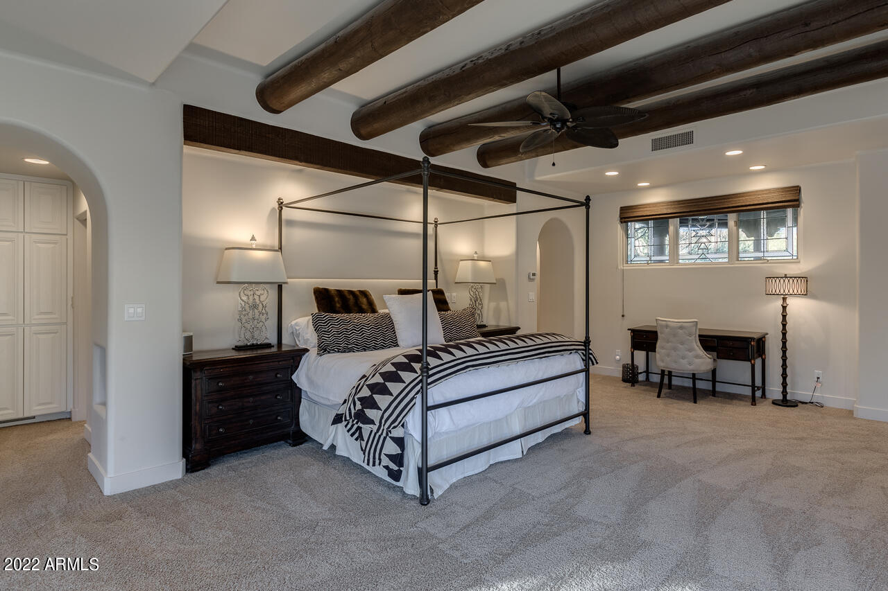 10801 East Happy Valley Road, Unit 74 Scottsdale, AZ 85255 - Photo 27 of 27 a spacious bedroom with a bed and a table