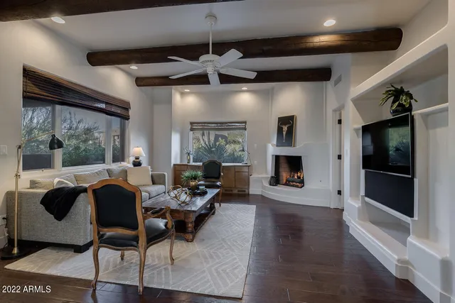 a living room with furniture rug and window