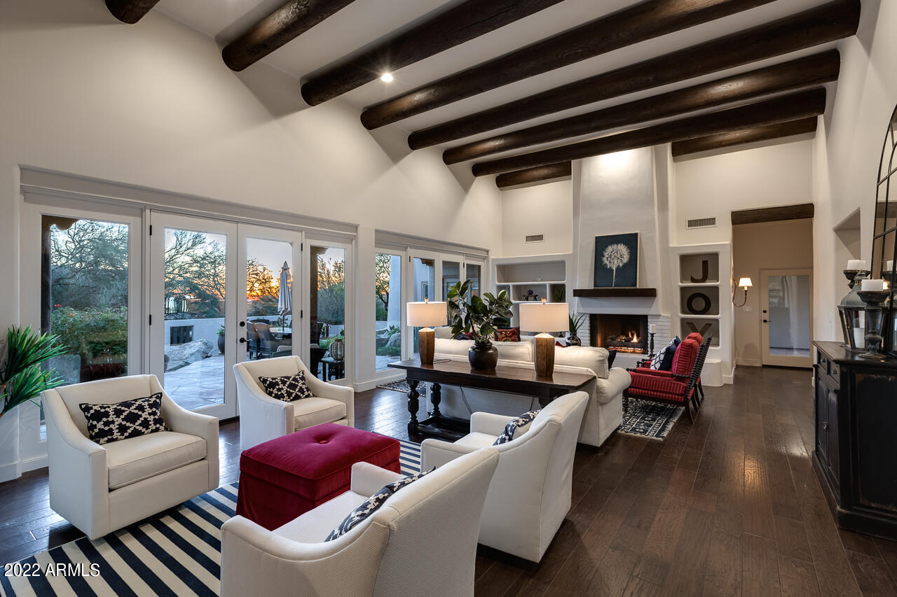 10801 East Happy Valley Road, Unit 74 Scottsdale, AZ 85255 - Photo 9 of 27 a living room with furniture fireplace and a large window