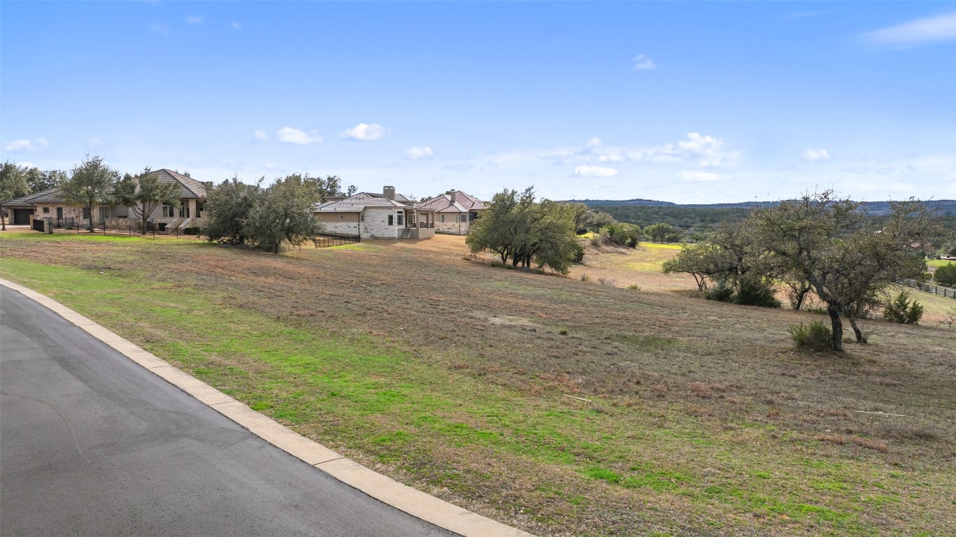 106 Quail Point Spicewood, TX 78669 - Photo 4 of 7 a view of a road with outside space