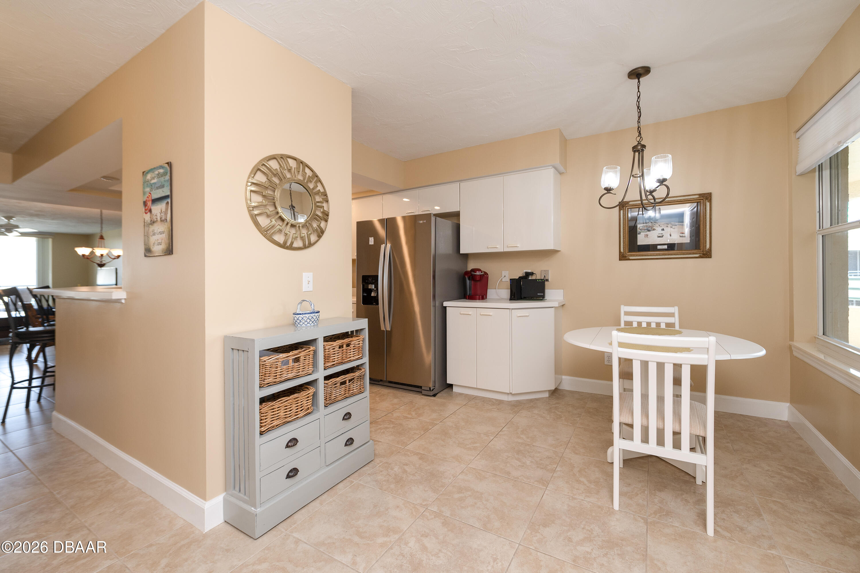 4575 South Atlantic Avenue, Unit 6701 Ponce Inlet, FL 32127 - Photo 13 of 35 a view of a dining room and chandelier