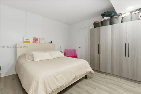 a bedroom with a bed and a cabinets