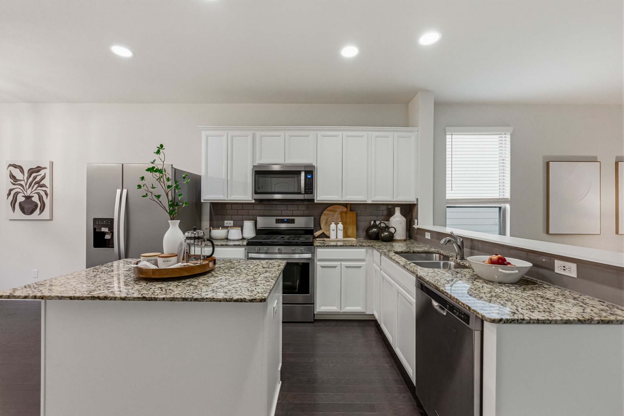 2124 Cliffbrake Way Georgetown, TX 78626 - Photo 7 of 31 Granite counters & modern white shaker cabinets will be the envy of your guests.