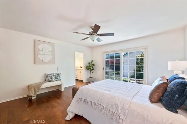 a bedroom with a bed couch and window