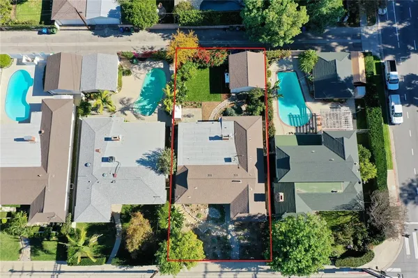 an aerial view of houses with outdoor space