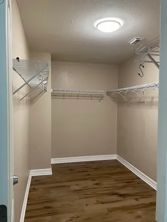 a view of an empty walk in closet