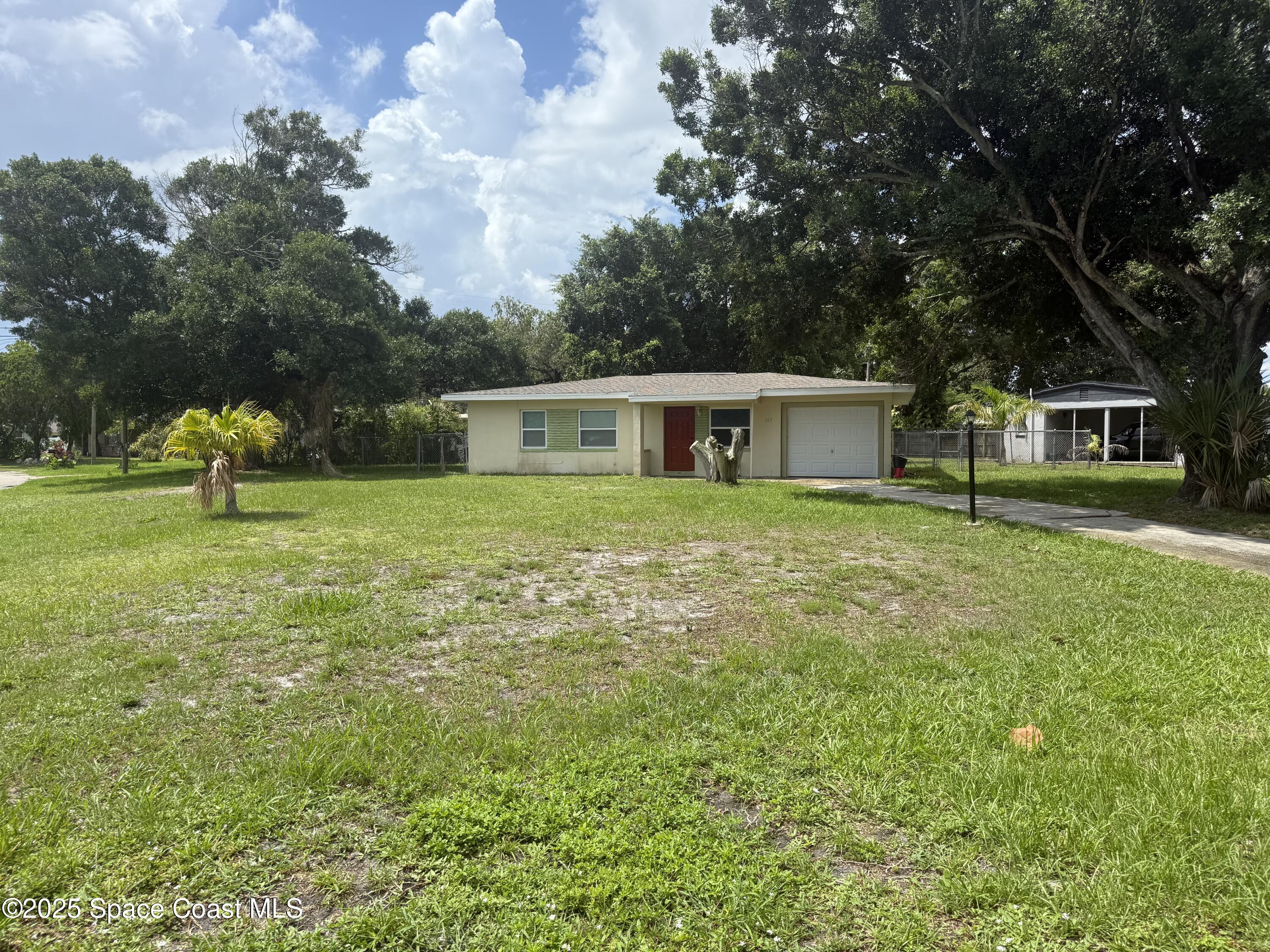 325 Patrick Circle Melbourne, FL 32901 - Photo 15 of 15 a house view with a garden space