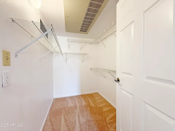 a view of a room with racks on the wall