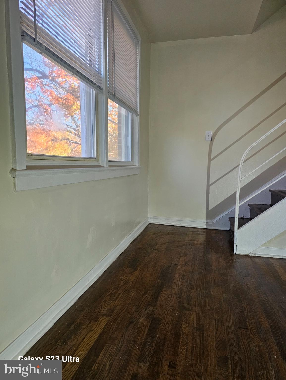 3855 28th Avenue, Unit 37 Temple Hills, MD 20748 - Photo 11 of 11 a view of an empty room with wooden floor and a window