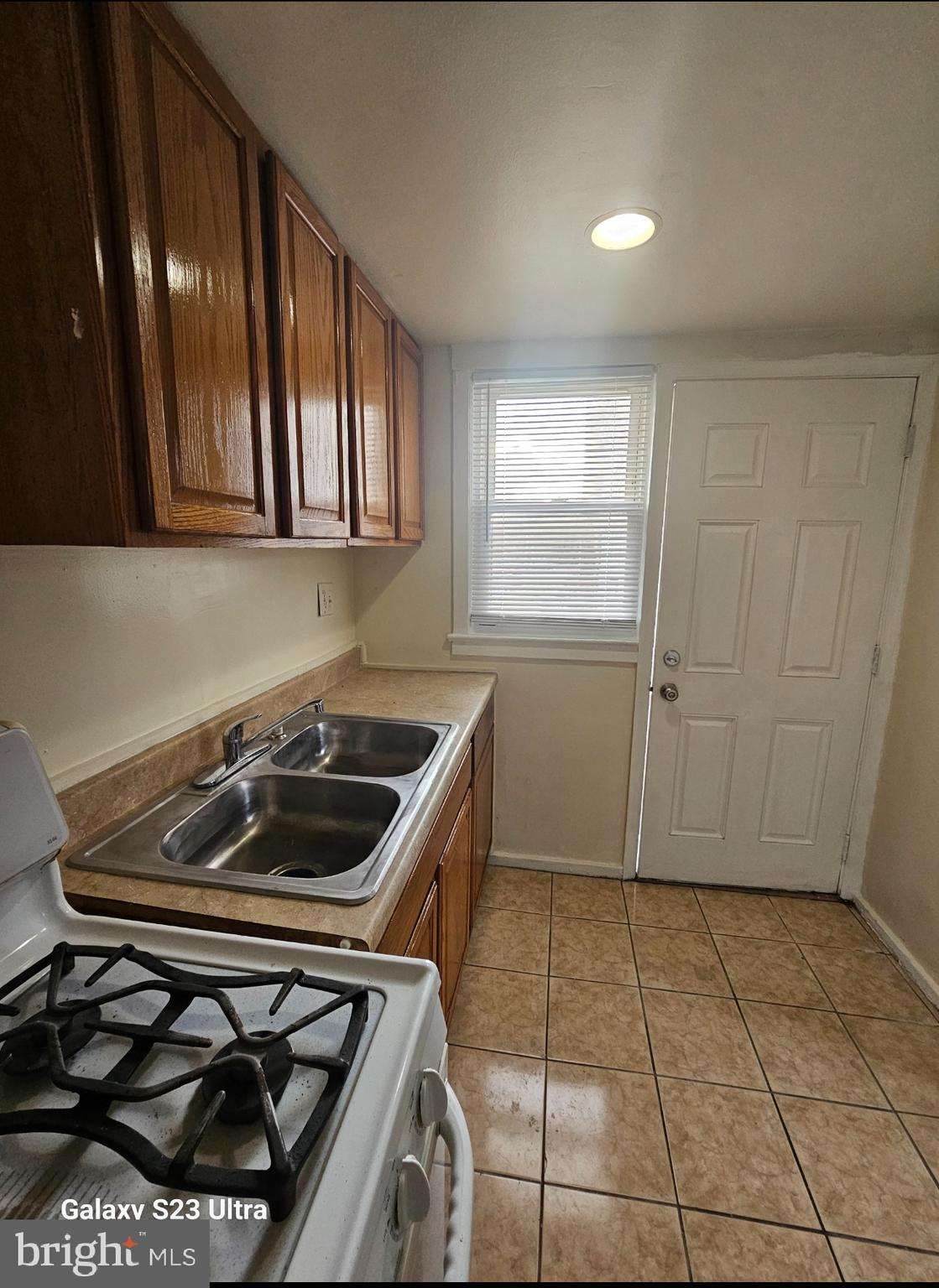 3855 28th Avenue, Unit 37 Temple Hills, MD 20748 - Photo 2 of 11 a kitchen with a stove a microwave and cabinets