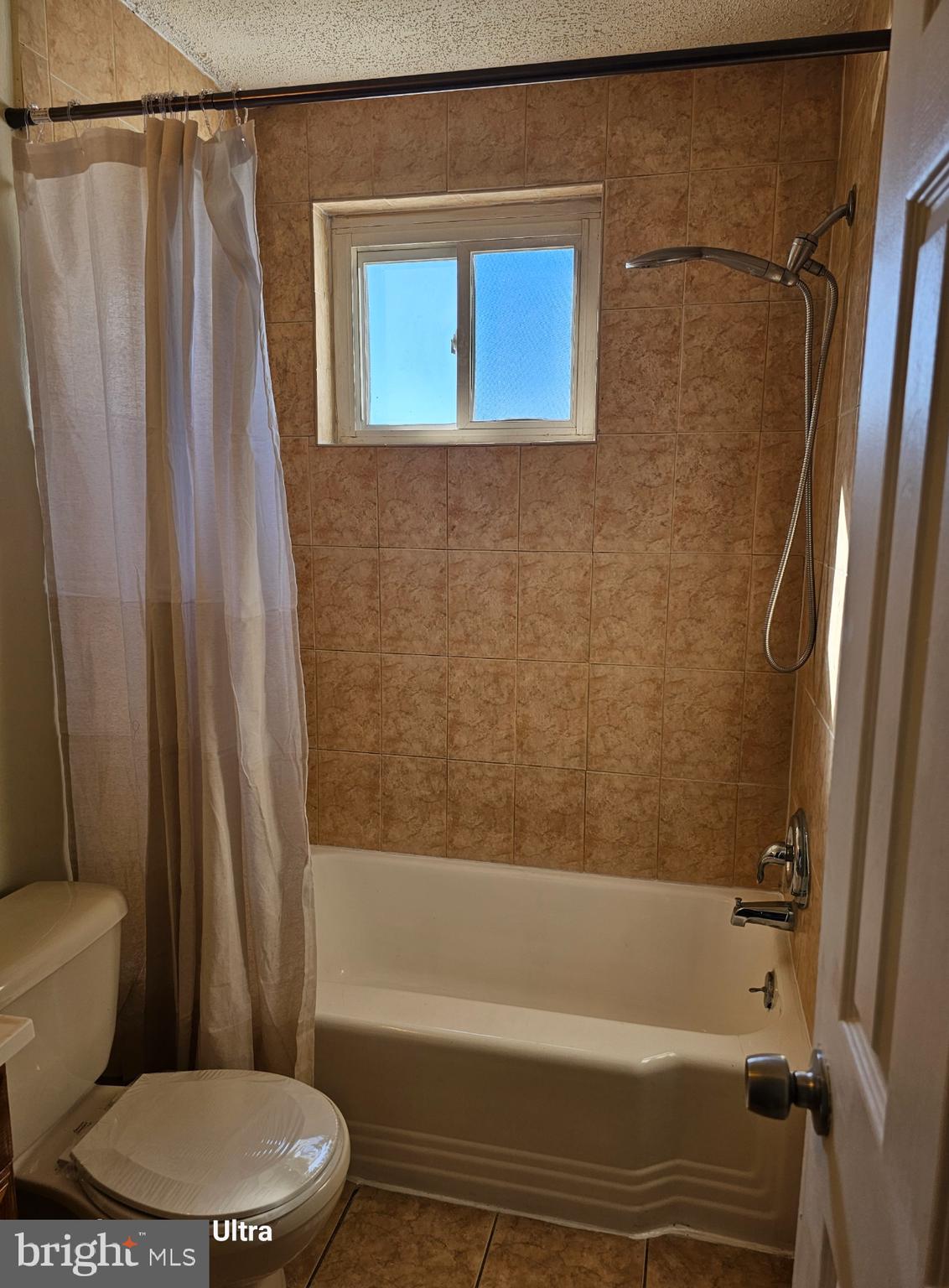 3855 28th Avenue, Unit 37 Temple Hills, MD 20748 - Photo 4 of 11 a bathroom with a toilet and a bathtub