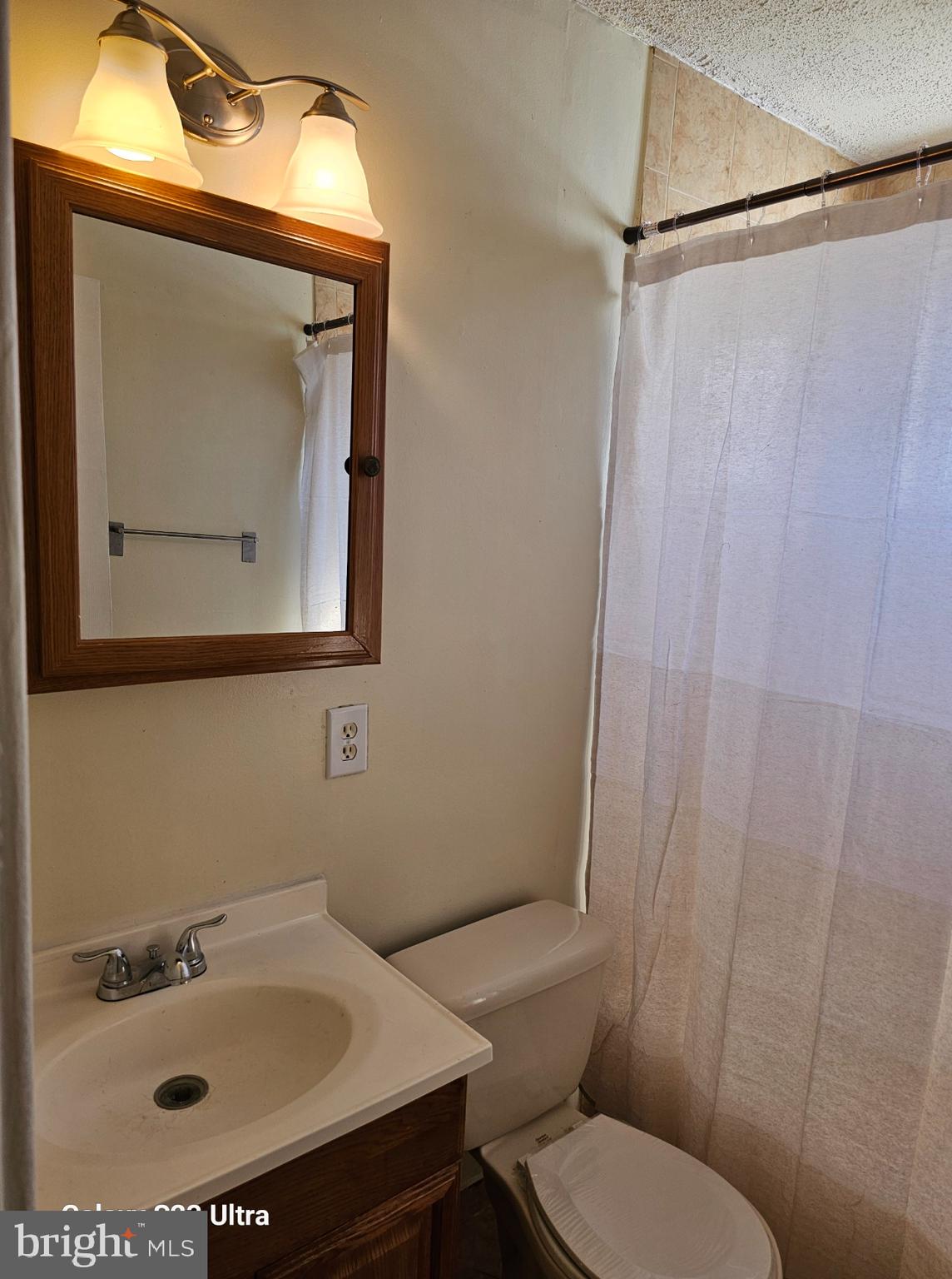 3855 28th Avenue, Unit 37 Temple Hills, MD 20748 - Photo 5 of 11 a bathroom with a sink toilet and mirror