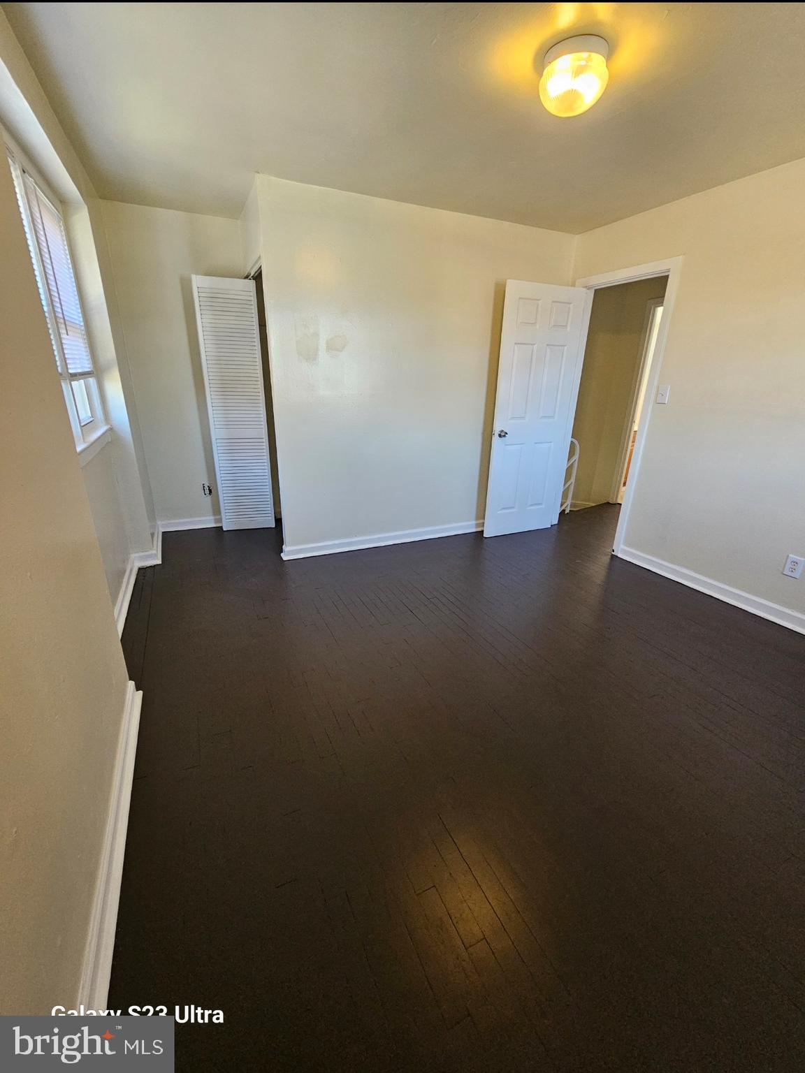 3855 28th Avenue, Unit 37 Temple Hills, MD 20748 - Photo 7 of 11 a view of an empty room with wooden floor