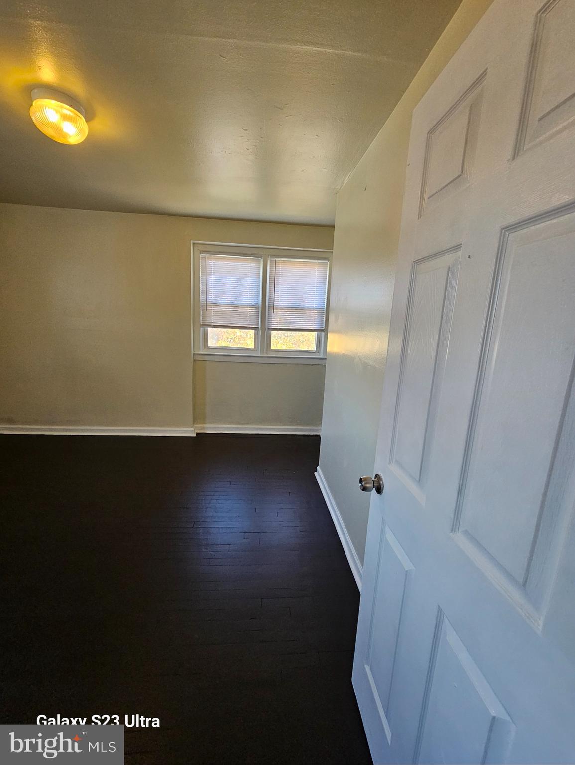 3855 28th Avenue, Unit 37 Temple Hills, MD 20748 - Photo 8 of 11 wooden floor in an empty room with a window