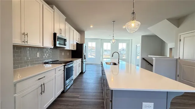 a view of an empty room with windows