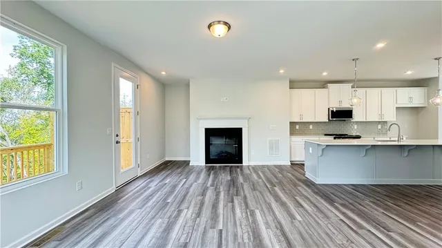 a view of a hallway with a wooden door
