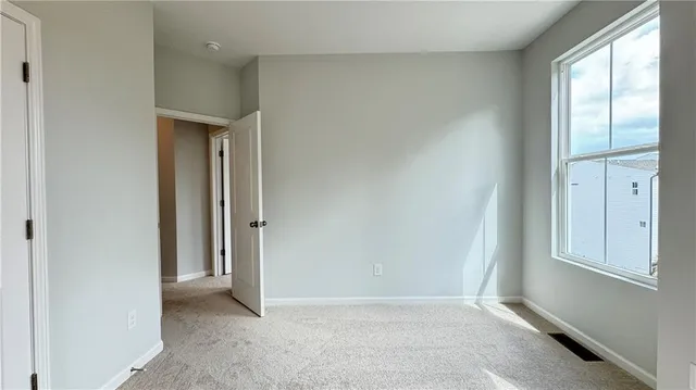 a view of a brick house with many windows