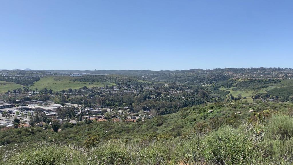 an aerial view of residential house and green space