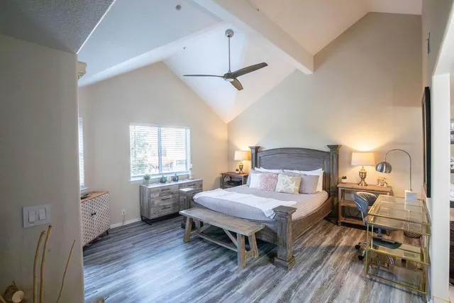 a spacious bathroom with a shower sink and mirror
