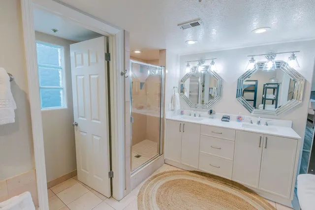 a living room with a couch and potted plant