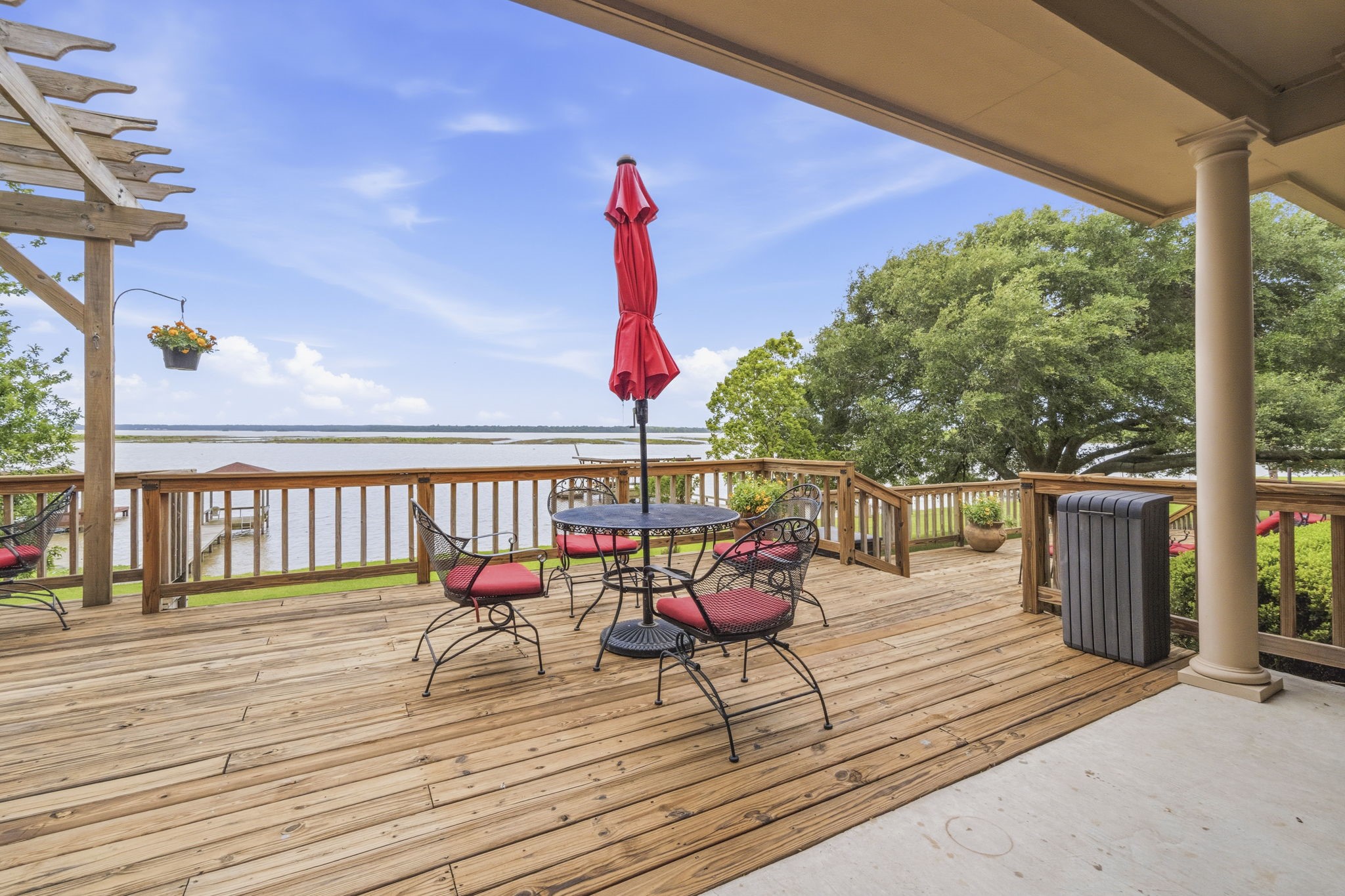259 Memphis Bell Lane Trinity, TX 75862 - Photo 30 of 50 a balcony with wooden floor table and chairs