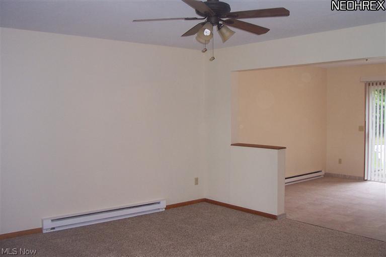 1532 North County Line Road Geneva, OH 44041 - Photo 8 of 22 First view of living room going into dining room. All new flooring.