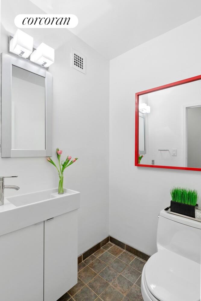 137 East 36th Street, Unit 3G Manhattan, NY 10016 - Photo 10 of 14 a bathroom with a granite countertop sink and a mirror