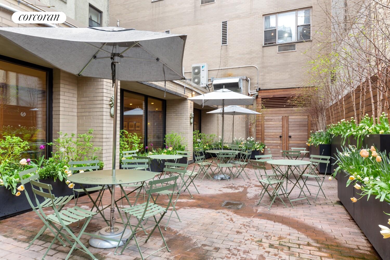 137 East 36th Street, Unit 3G Manhattan, NY 10016 - Photo 12 of 14 a view of a patio with table and chairs and potted plants