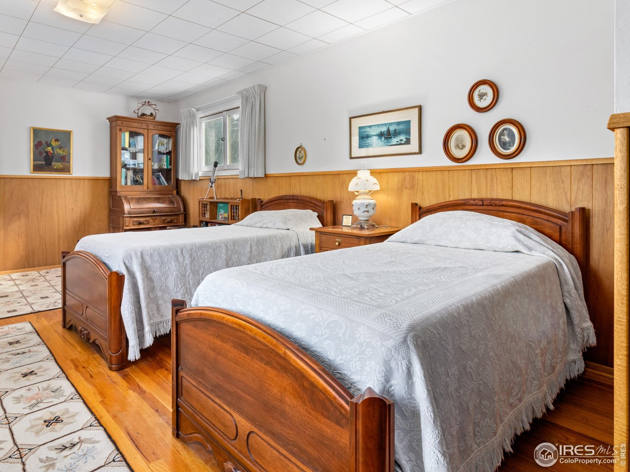 1475 Lower Broadview Road Estes Park, CO 80517 - Photo 7 of 33 Large Bedroom with Wood Floors