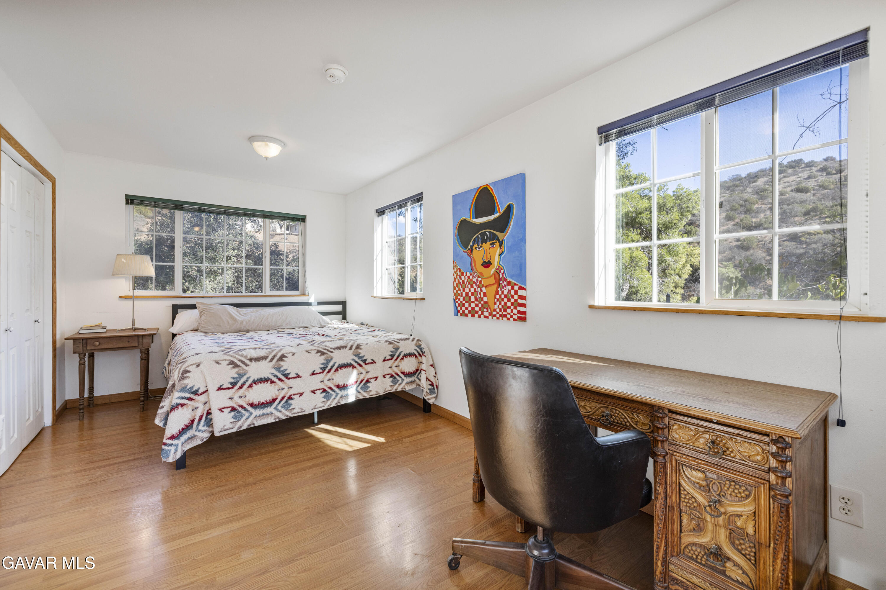 32901 Hawley Road Acton, CA 93510 - Photo 10 of 44 a bedroom with a bed and wooden floor