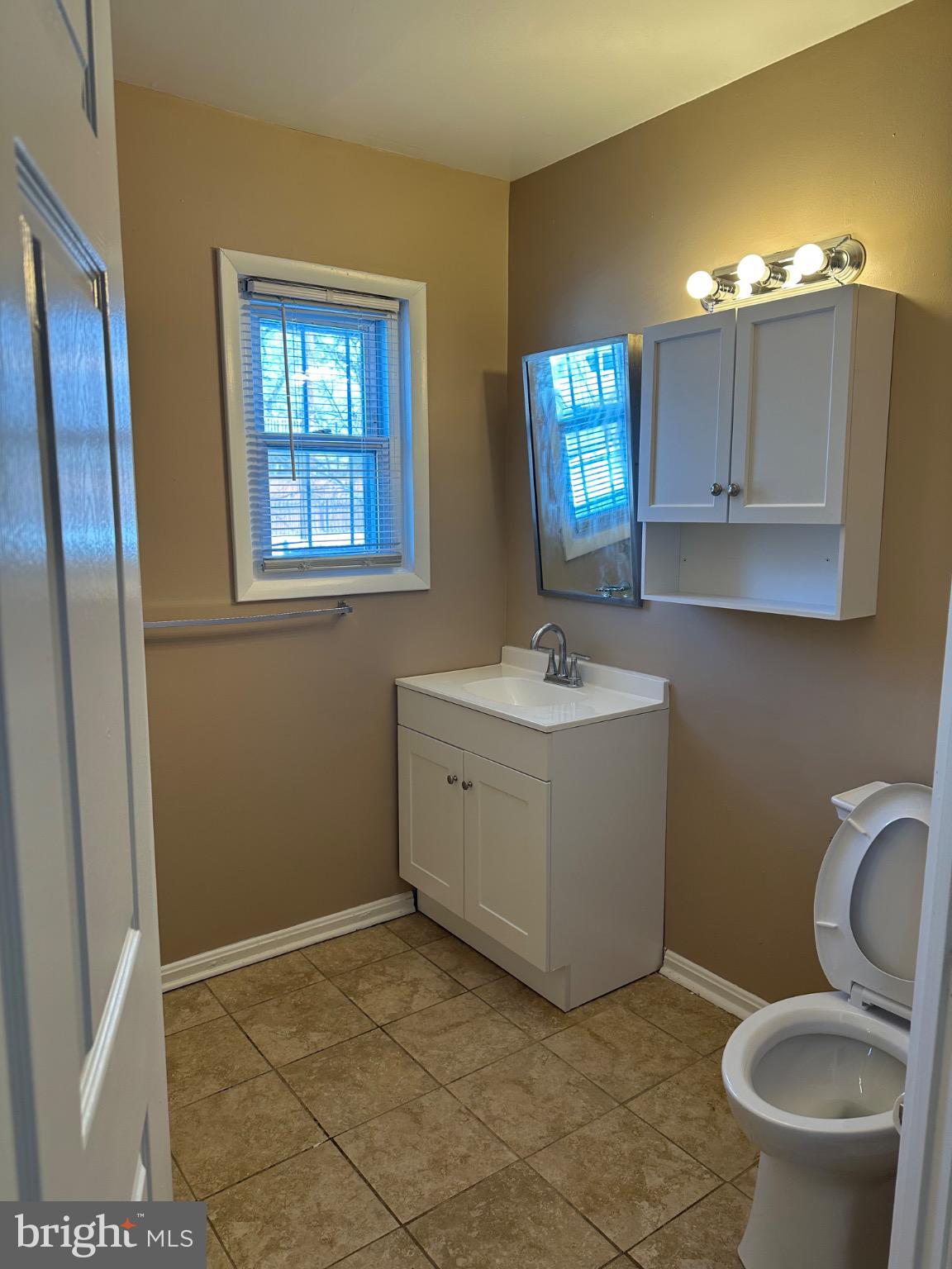1449 Olive Street Northeast, Unit 4 Washington, DC 20019 - Photo 12 of 19 Bright and inviting bathroom with modern touches.