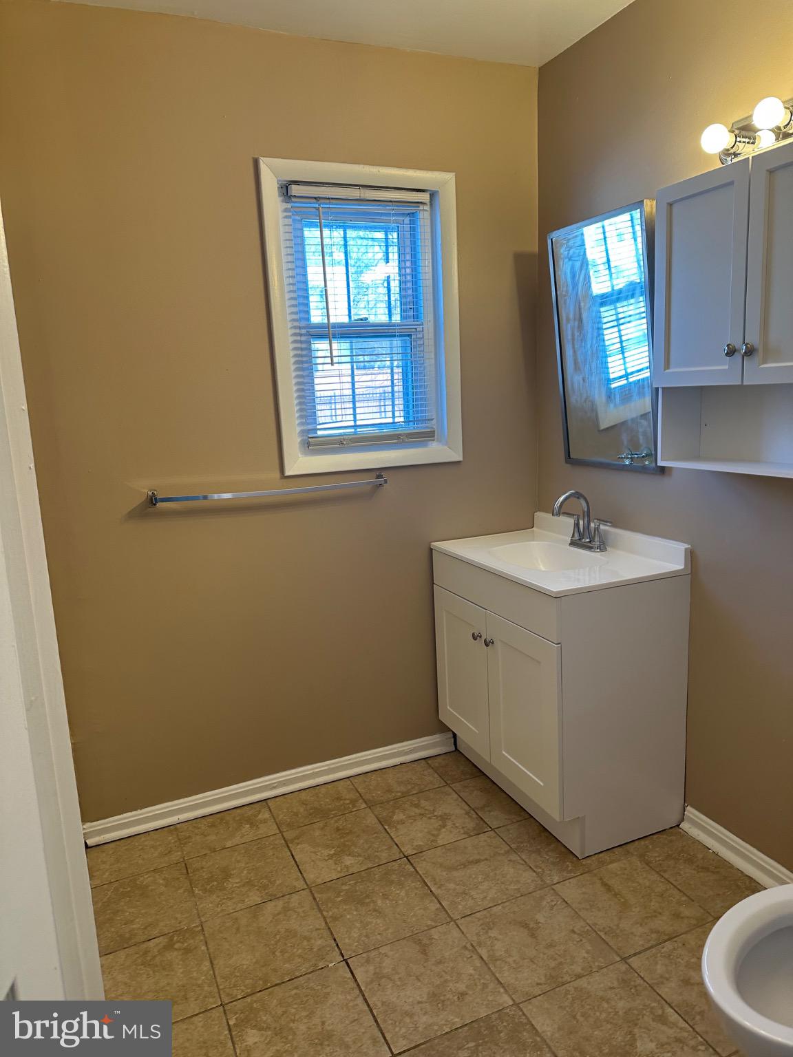 1449 Olive Street Northeast, Unit 4 Washington, DC 20019 - Photo 13 of 19 Bright and airy bathroom with modern finishes.