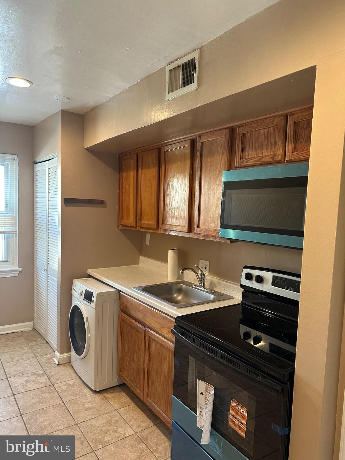 1449 Olive Street Northeast, Unit 4 Washington, DC 20019 - Photo 3 of 19 Cozy kitchen with modern appliances.