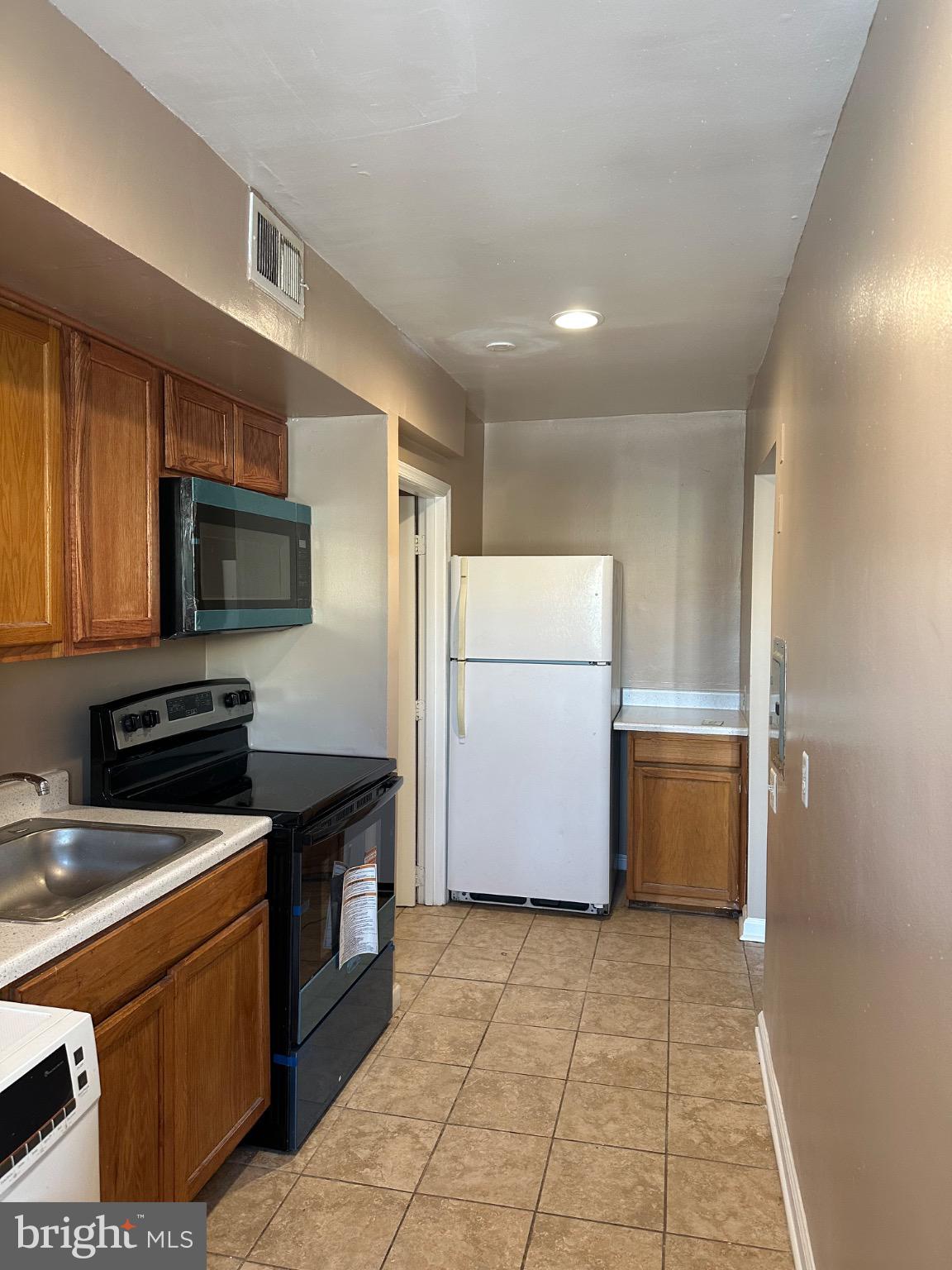 1449 Olive Street Northeast, Unit 4 Washington, DC 20019 - Photo 6 of 19 Modern kitchen with sleek finishes.