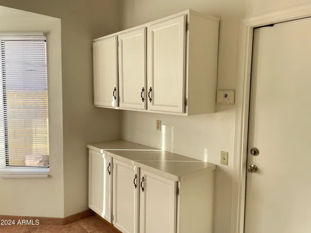 a view of cabinets and wooden floor