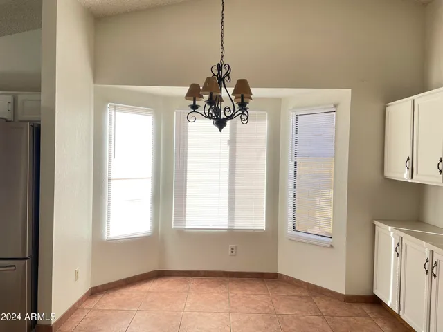 a view of a room with window and cabinet