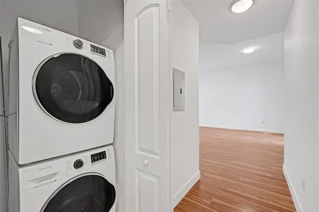 a view of a hallway with washer and dryer