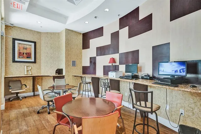 a front view of a house with a yard and fountain