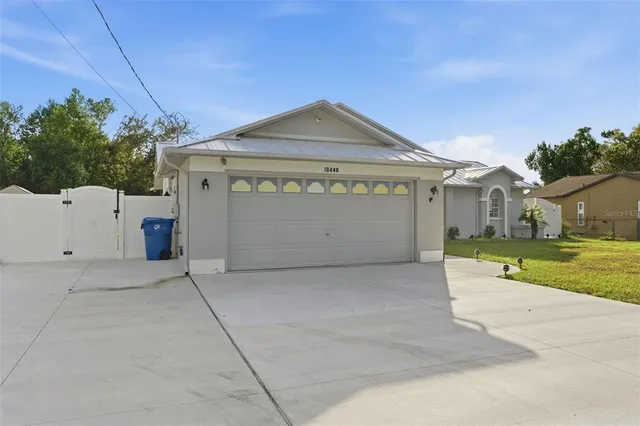 a view of backyard with outdoor seating and green space
