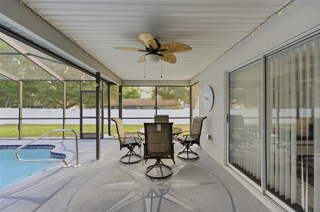 10448 Utah Street Spring Hill, FL 34608 - Photo 14 of 54 a view of a dining room with furniture window and outside view