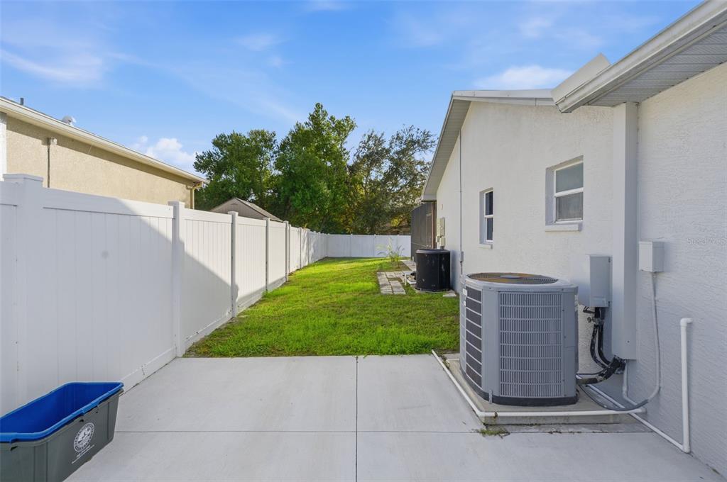 10448 Utah Street Spring Hill, FL 34608 - Photo 21 of 54 a view of backyard with outdoor seating and green space