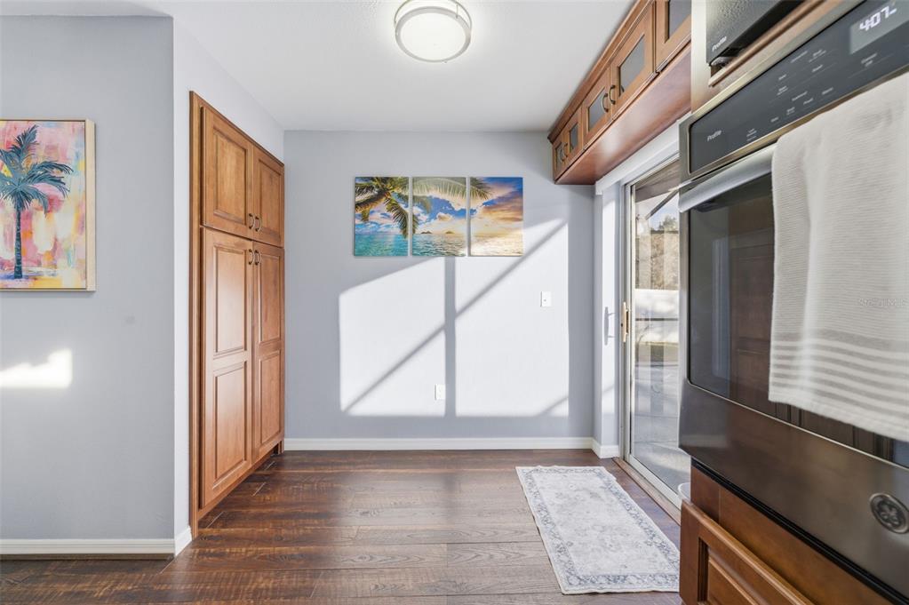 10448 Utah Street Spring Hill, FL 34608 - Photo 31 of 54 a view of front door with wooden floor