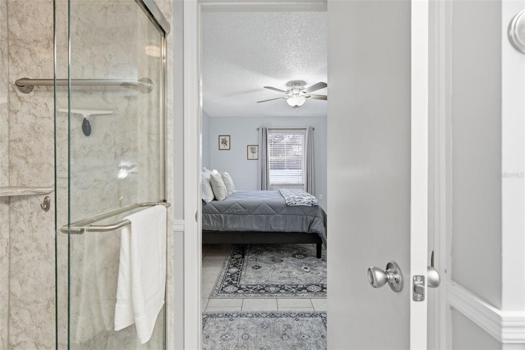 10448 Utah Street Spring Hill, FL 34608 - Photo 52 of 54 a bathroom with a tub shower sink and mirror