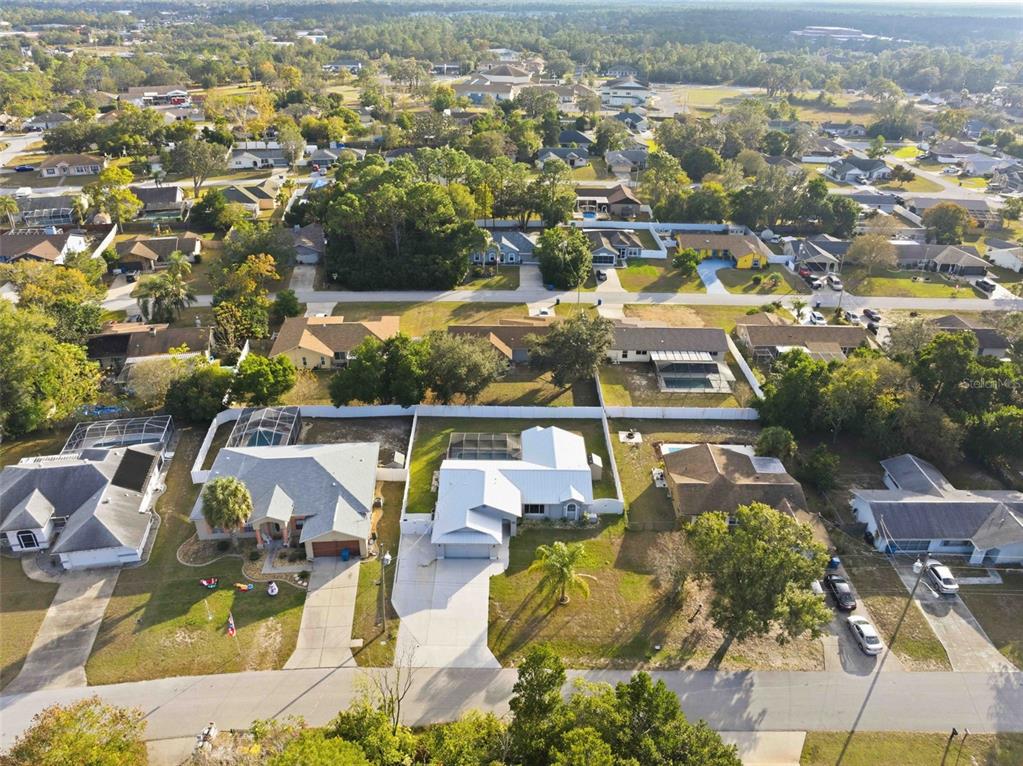 10448 Utah Street Spring Hill, FL 34608 - Photo 6 of 54 an aerial view of residential houses with outdoor space