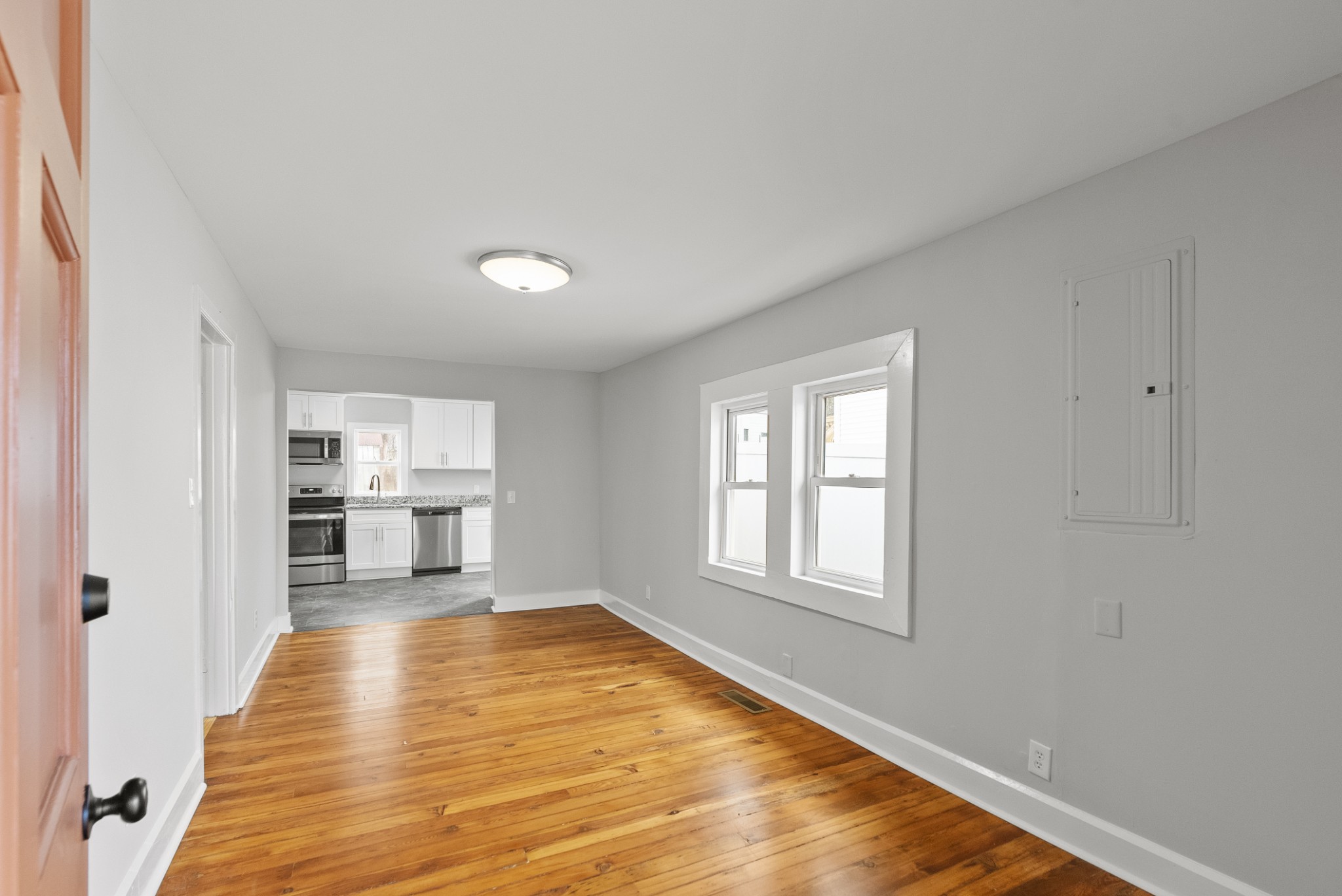 104 North Walnut Street Springfield, TN 37172 - Photo 11 of 19 a view of a kitchen with furniture and wooden floor