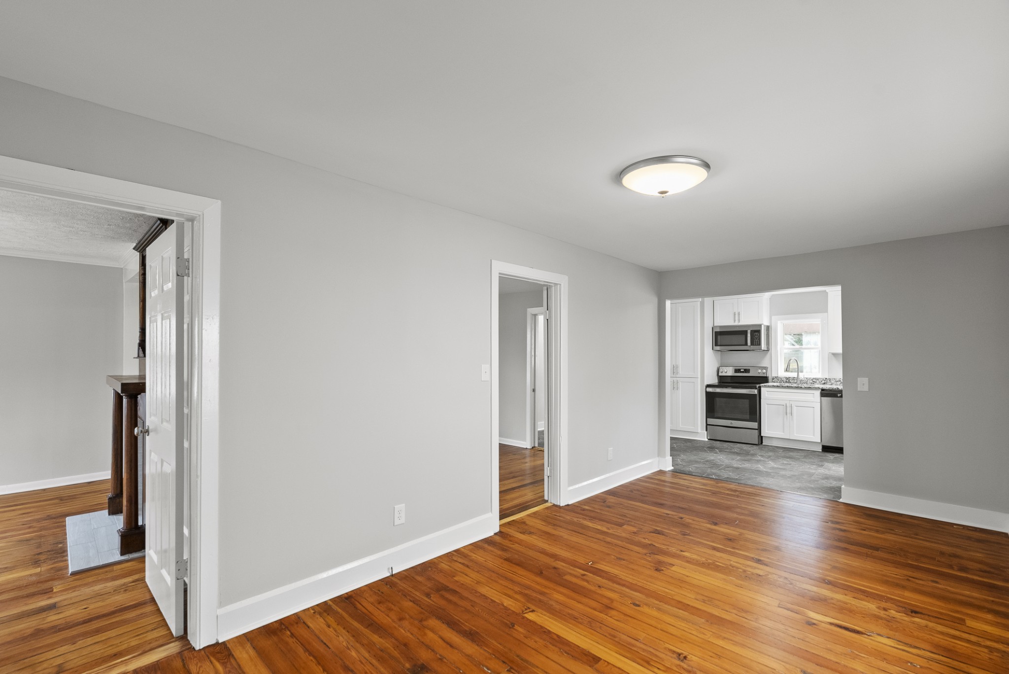 104 North Walnut Street Springfield, TN 37172 - Photo 12 of 19 a view of a kitchen with wooden floor and a refrigerator