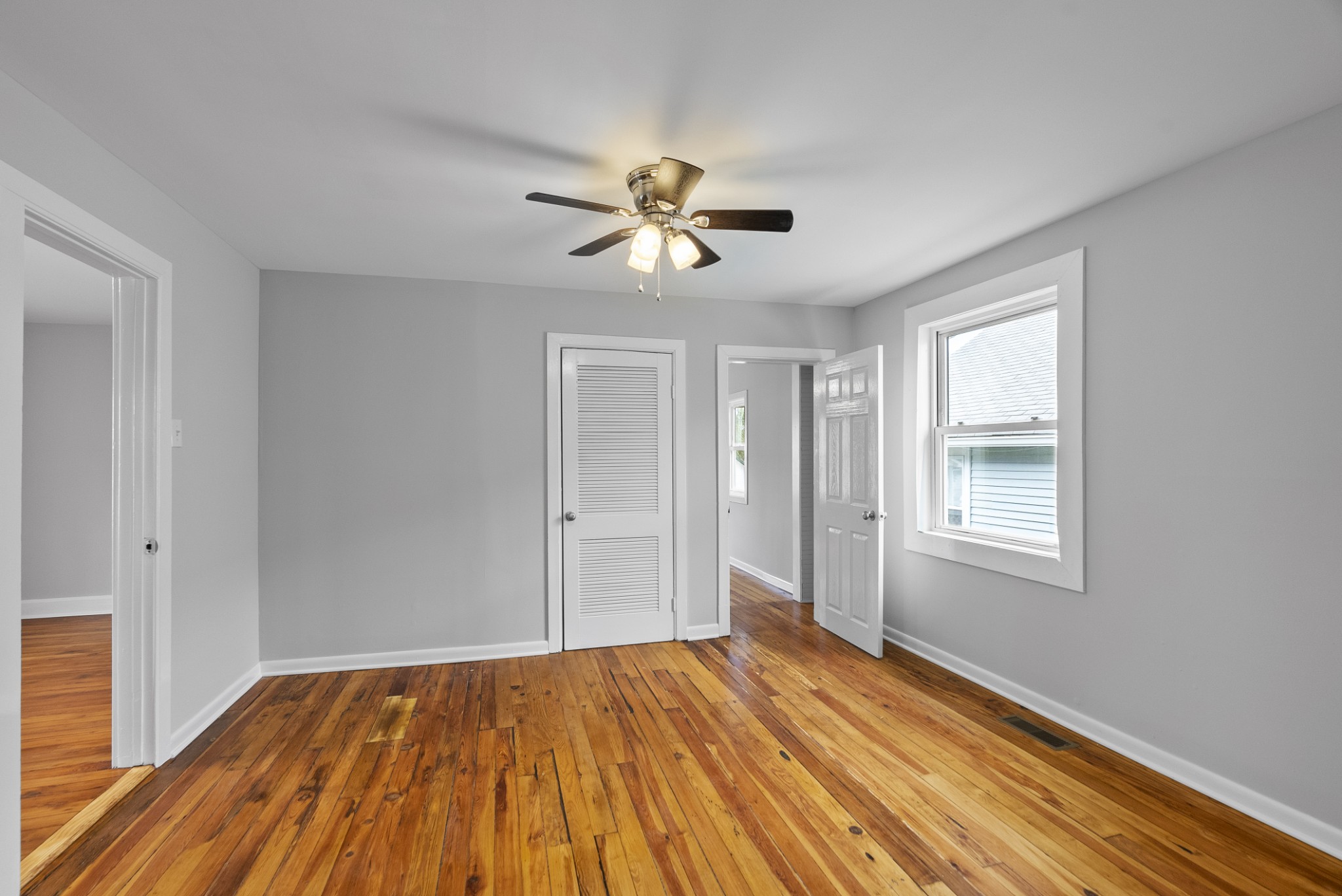 104 North Walnut Street Springfield, TN 37172 - Photo 13 of 19 a view of empty room with wooden floor and fan