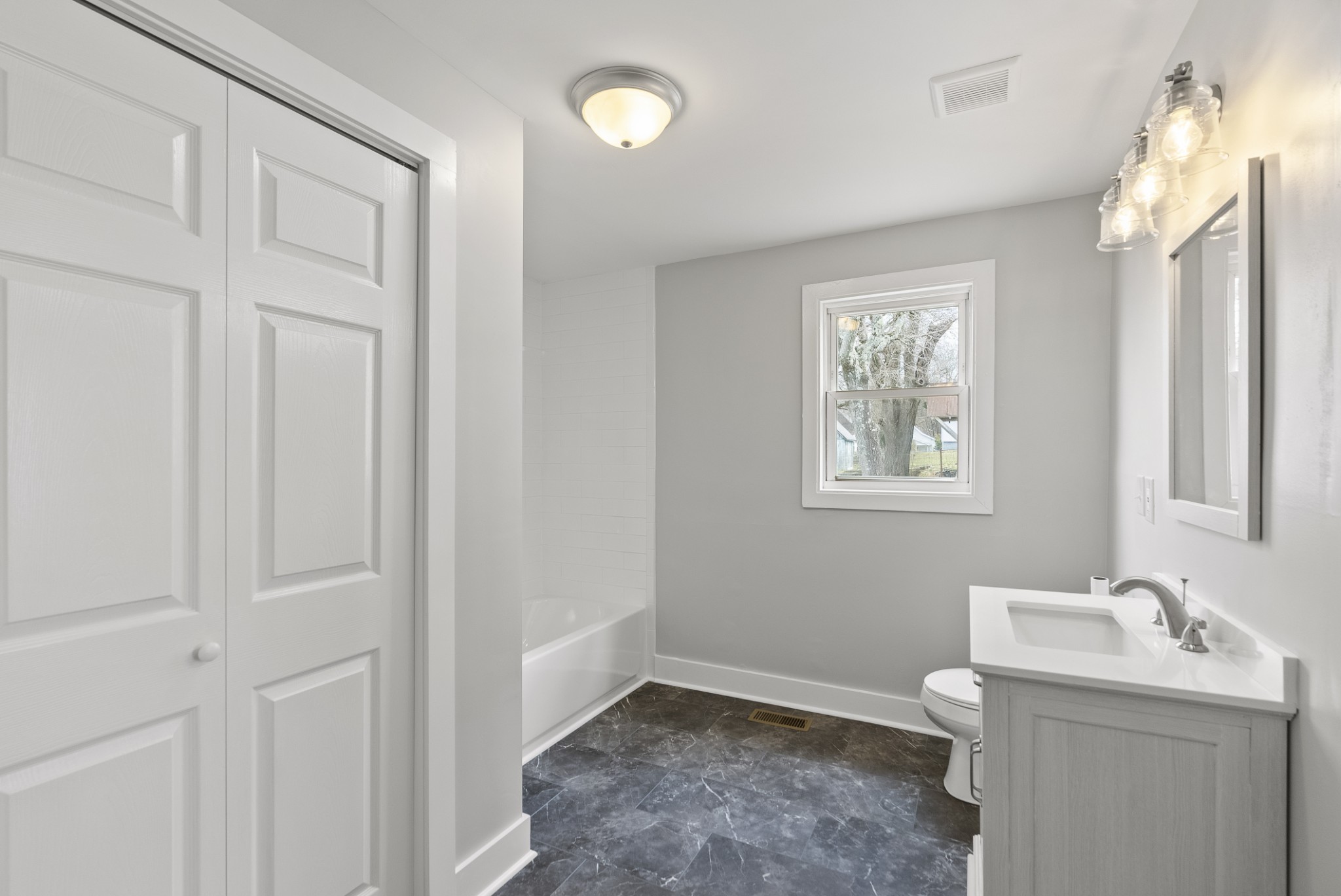 104 North Walnut Street Springfield, TN 37172 - Photo 18 of 19 a bathroom with a sink a toilet and a window